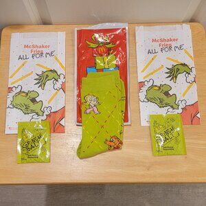 Pair of Grinch Socks & 2 Shakers Bags & 2 Grinch Dill Pickle Salts. McDonald's.